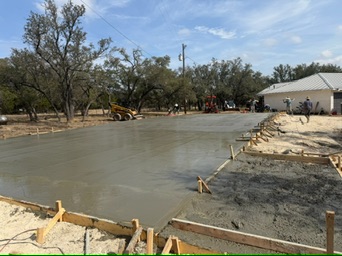 Fresh Georgetown shop foundation with troweled surface and braced perimeter forms