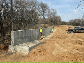 Concrete retaining-wall section later in the Riesel-area project sequence