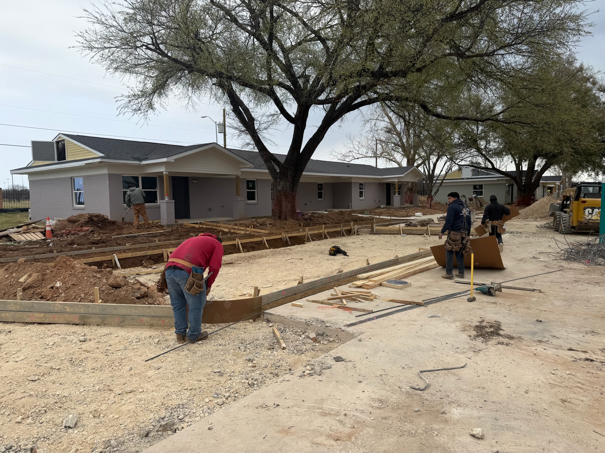 Wood forms, aggregate base, and reinforcement for accessible parking at Melody Grove