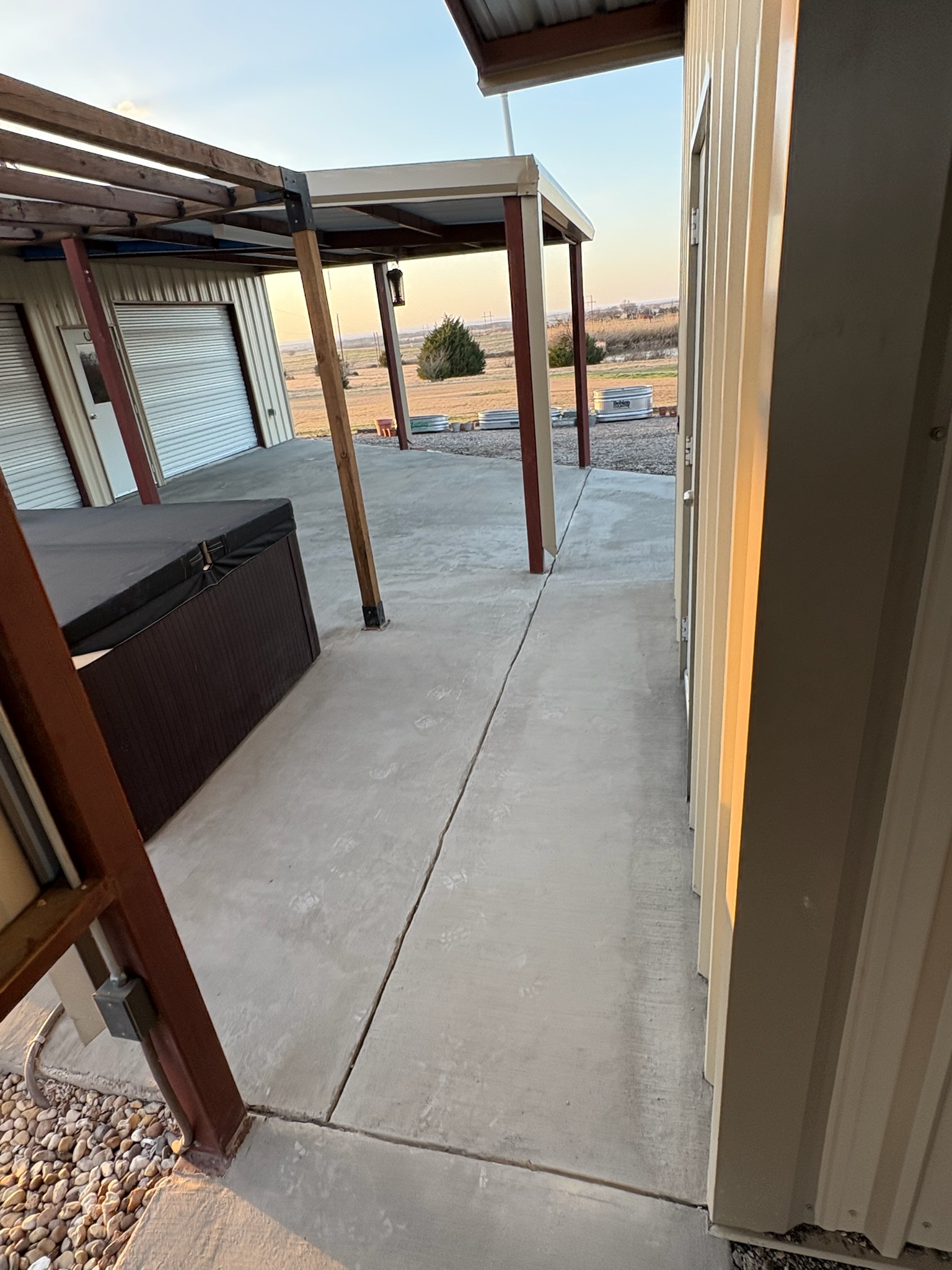 Renewed concrete surface beside the Hubbard shop roll-up door