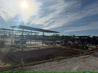 Magnolia RV pad layout around covered bays, open grade, and utilities